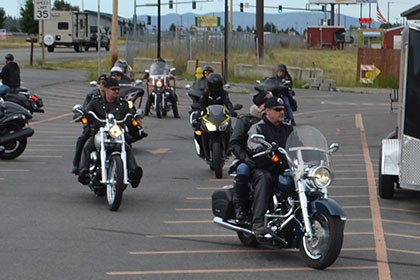 Riders gather in the parking lot.