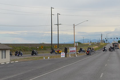 Pausing traffic while riders embark on their ride route.