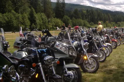 Long lines of motorcycles stretch into the distance.