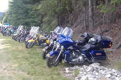 Long line of motorcycles stretches into the distance.