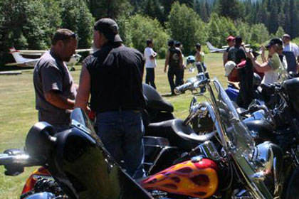 Long line of motorcycles stretches into the distance.