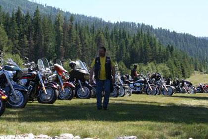 Long lines of motorcycles stretch into the distance.