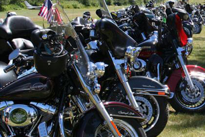 Long lines of motorcycles stretch into the distance.