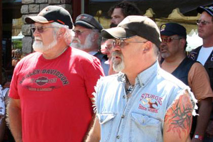 People stand in group at event.