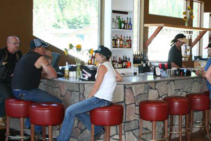 People sit at a bar.