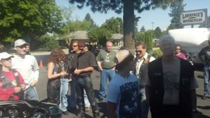 People standing in the parking lot.