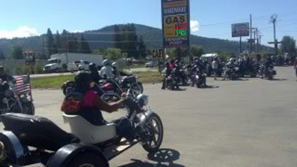 A bunch of motorcycles in parking lot.