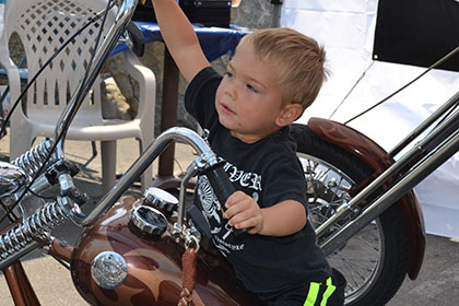 Young child on a motorcycle.