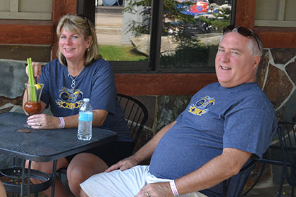 Ride for Life committee members sitting at a table outside.