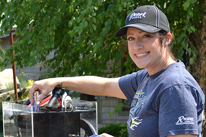 Ride for Life committee member with raffle tickets.
