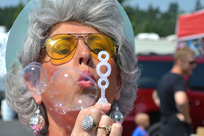 Blowing bubbles.