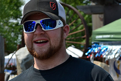Man wearing sunglasses and a hat.