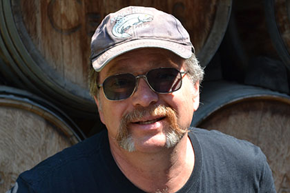 Man with sunglasses and hat.