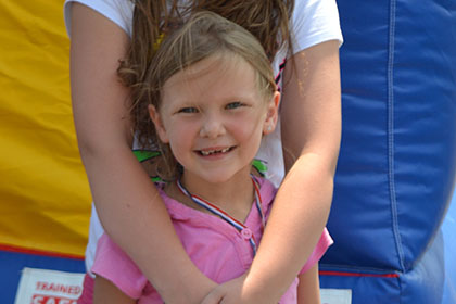 Two girls smile for the camera.