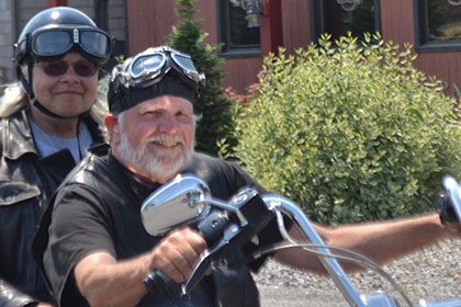 Two riders on a motorcycle.