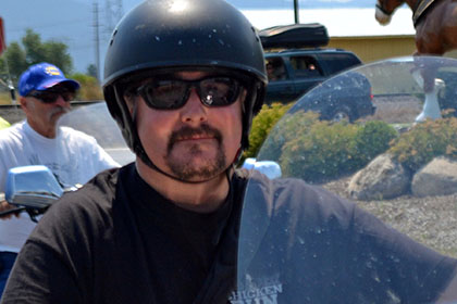 A man on his motorcycle.
