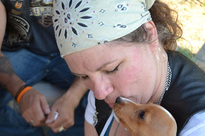 A woman and her little dog.