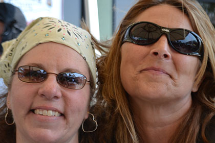 Two women smile for the camera.