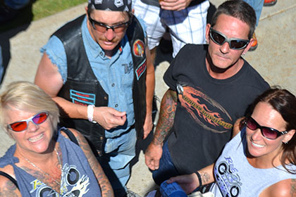 Small group of people smile for the camera.