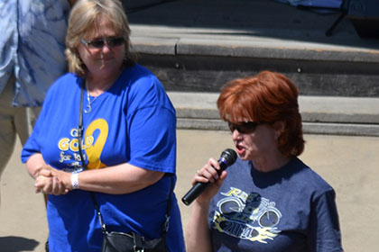 A woman speaking on the microphone.