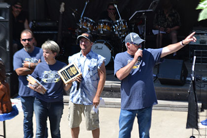 Ride for Life committee members on stage.