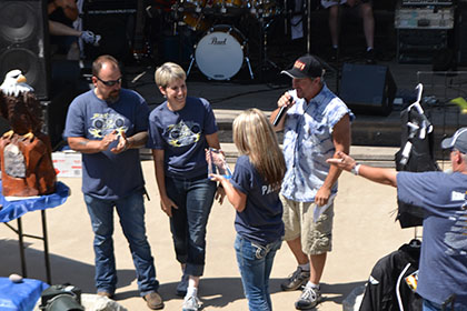 Ride for Life committee members on stage.