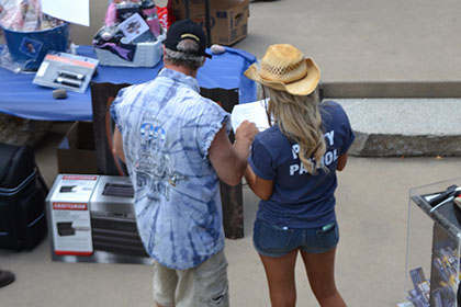 People checking out the auction items.