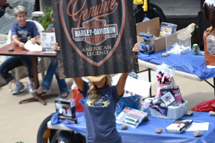 Woman holding up a sign.