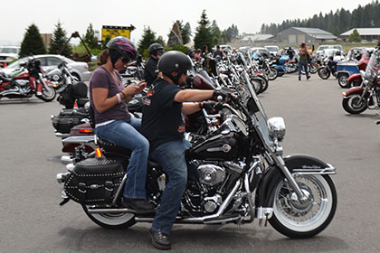 Finding a spot to park their motorcycle.