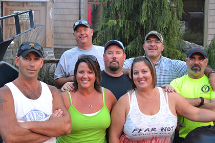 Posing for a photo next to the barbecuer.