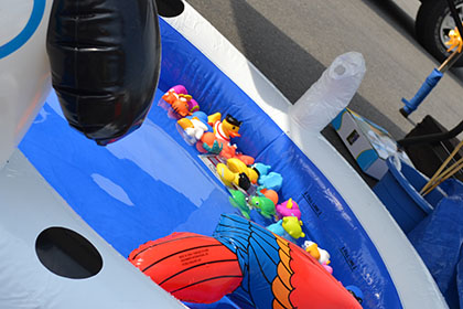 Toys floating in a blow up pool.