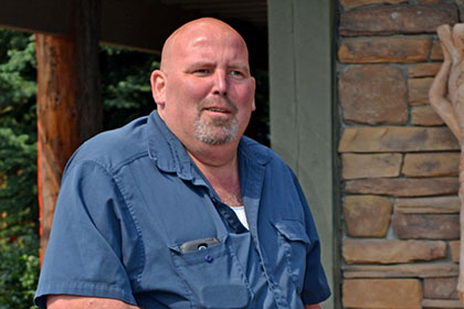Man holding a boot box.