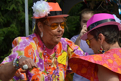Bright colored dresses and hats.