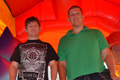 Posing for their photo in the bouncy castle.