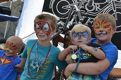Children with their face painted.