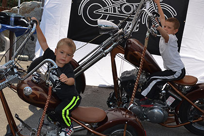 Children on the display motorcycles.