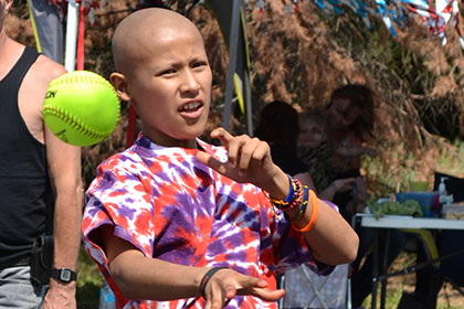 Throwing the ball at the dunk tank.