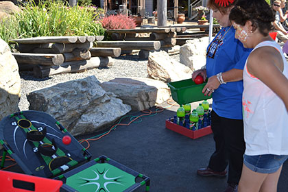 A woman and child playing games at the event.