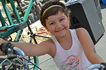Child sitting on a motorcycle.
