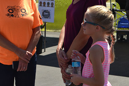 Some people speaking to a Ride for Life volunteer.