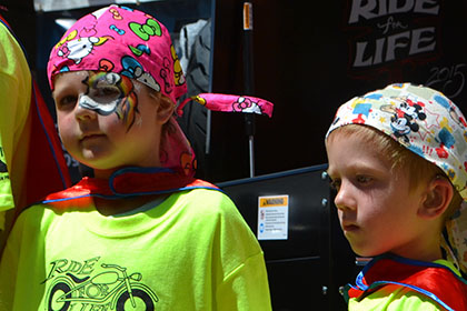 Some children wearing capes and bandanas.