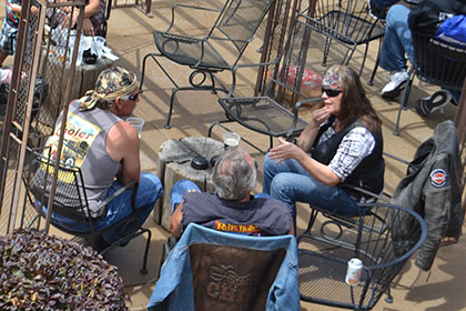 People sitting in chairs outside.