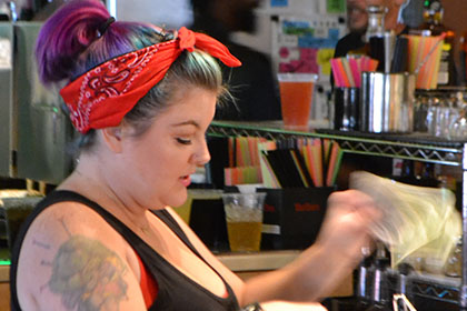 Woman operating the cash register.