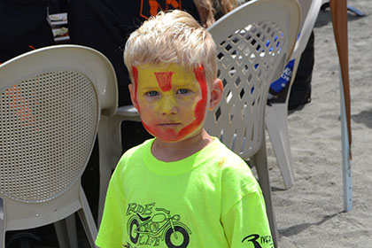 Child with his face painted.