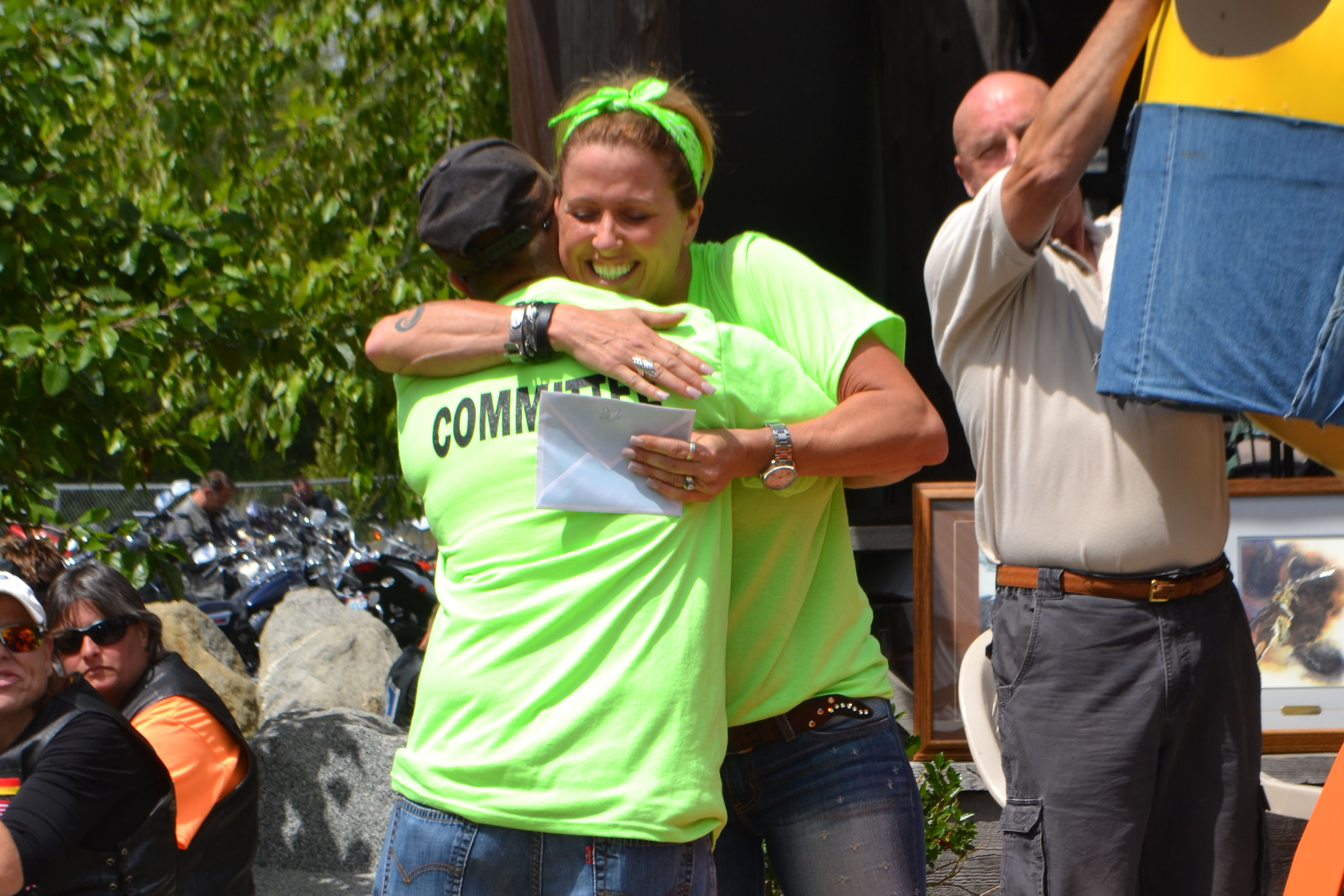 Two Ride for Life committee members embracing each other.
