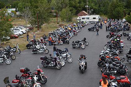 Many motorcycles parked at the event.