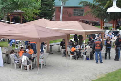 Tents and people outside at the event.