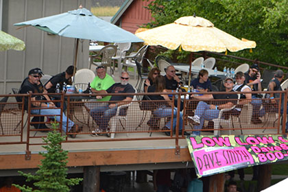 People sitting outside on the upper level.