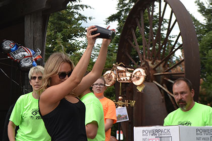 Man on microphone and other Ride for Life committee members.