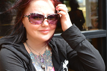 Woman with purple sunglasses.